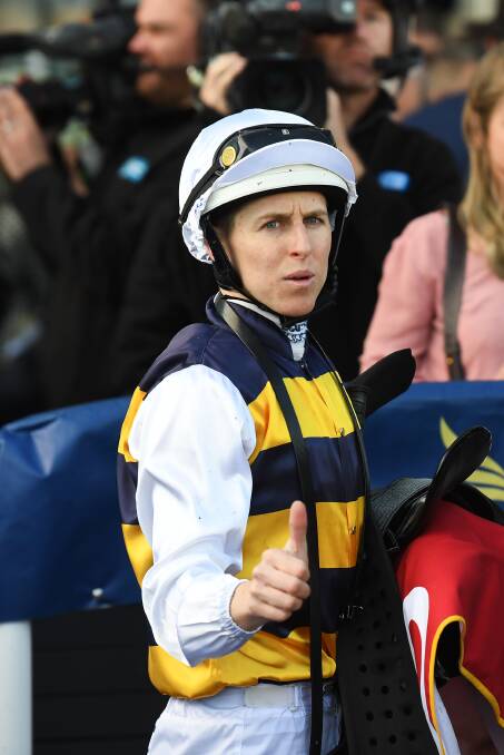 THUMBS UP: Damian Lane is pictured after winning aboard Night's Watch at Caulfield on Saturday. The win has earned the horse a 1kg penalty for the Caulfield and Melbourne cups.