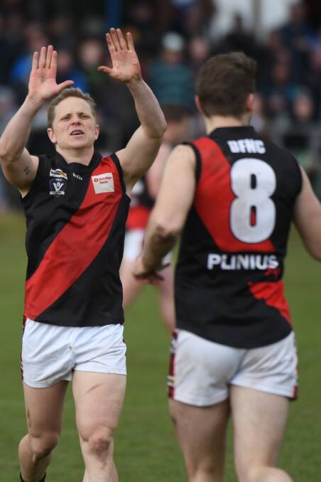 HIGH FIVES: Buninyong coach Jarrod Morgan celebrates on Sunday. Pictures: Kate Healy.