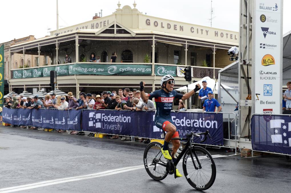 GLORY: Declan Trezise celebrates after crossing the line to win the junior men's criterium in Ballarat on Friday. Picture: Kate Healy.