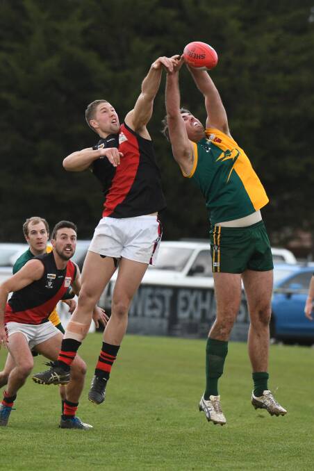 TALL TIMBER: Buninyong's Liam Rigby and Gordon's Zac May compete for the ball during Sunday's senior preliminary final.