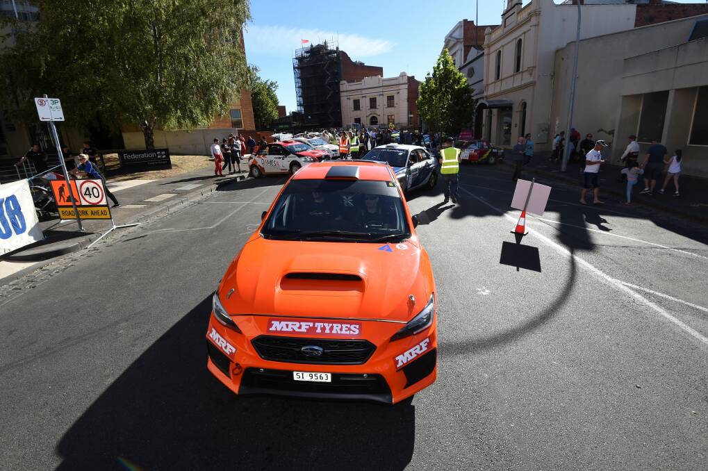 CITY START: A car leaves Camp Street in Ballarat as the 2018 Eureka Rally begins on Saturday morning in the city centre.
