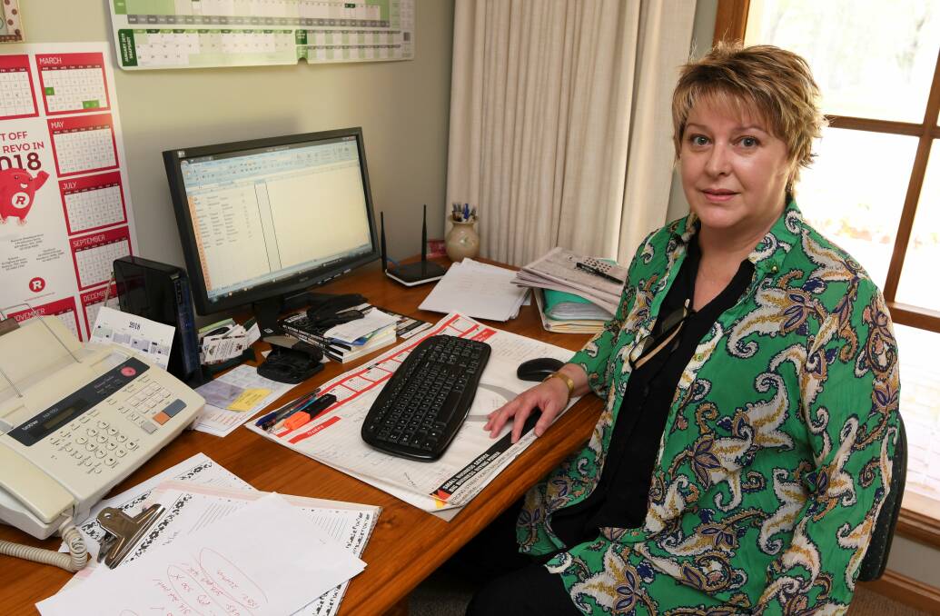 HARD WORK: CHFL manager Diane Ryan in her home office. Pictures: Lachlan Bence.