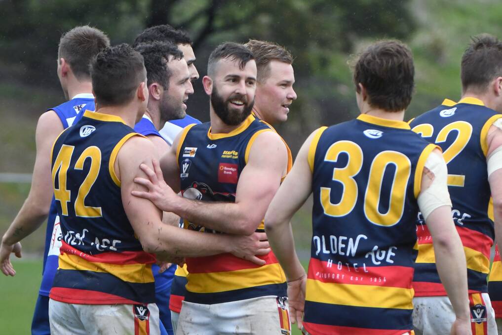 HAPPY: Daniel Venditti, pictured celebrating a goal with Beaufort teammates on Saturday, was one of the standout players for the Crows. Pictures: Kate Healy.