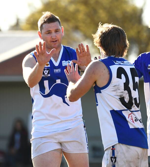 HIGH FIVES: Veteran forward John Coleman is pictured celebrating a goal for Waubra this season.