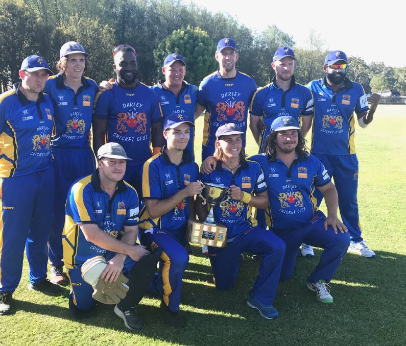 CHAMPIONS: Darley players celebrate victory over Bacchus Marsh in Monday's Cricket Willow Cup division one final. The Lions won the clash by 18 runs.