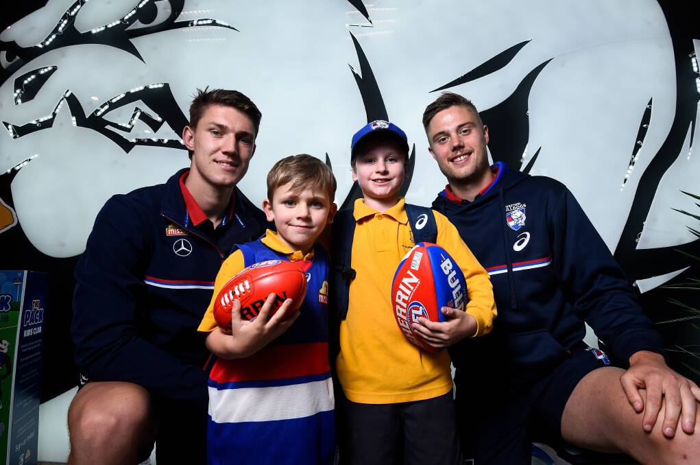 Mason and Angus McDonald with Jordon Sweet (left) and Josh Schache (right). Picture: Adam Trafford.