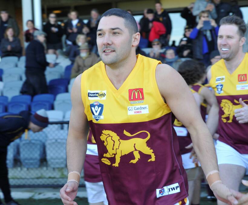 FAMILIAR DESIGN: Shaun Grigg runs out wearing the Redan jumper after making his return to the club in 2019.