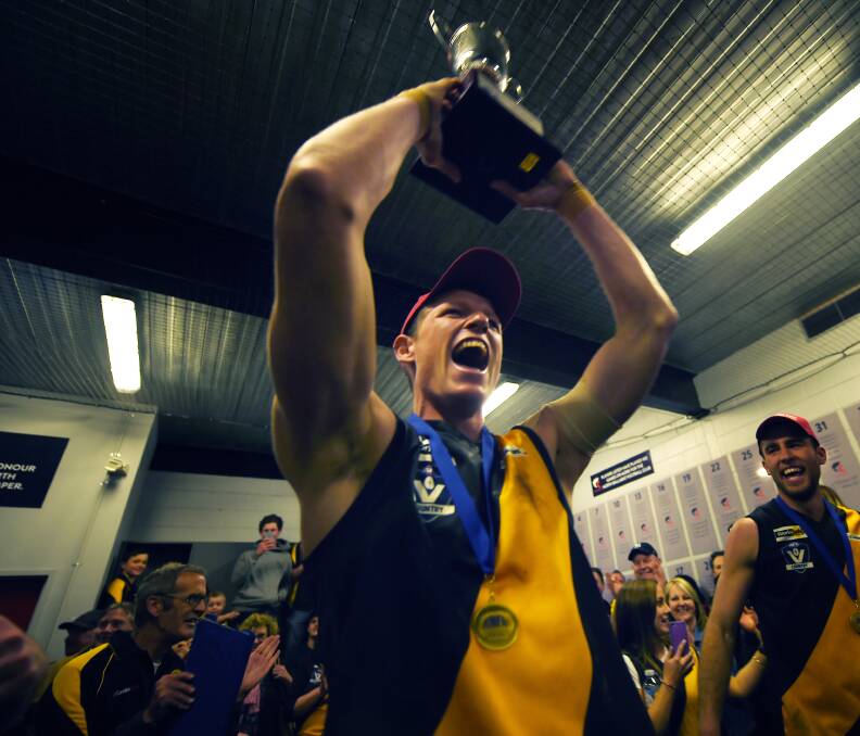 SEE YOU LATER: Matt Tyler, pictured lifting the Central Highlands Football League premiership cup in 2015, has left Springbank for old club Rupanyup in the Horsham District competition.
