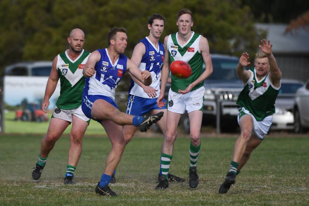 Waubra's Tom Nash gets a kick away on Saturday. Picture: Kate Healy.