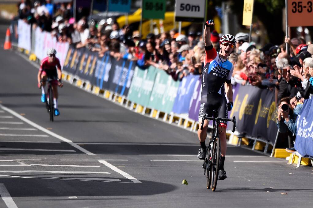 VICTORIOUS: Jarrad Drizners raises his arm in triumph after winning the men's under-23 road race on Saturday afternoon. Picture: Adam Trafford.