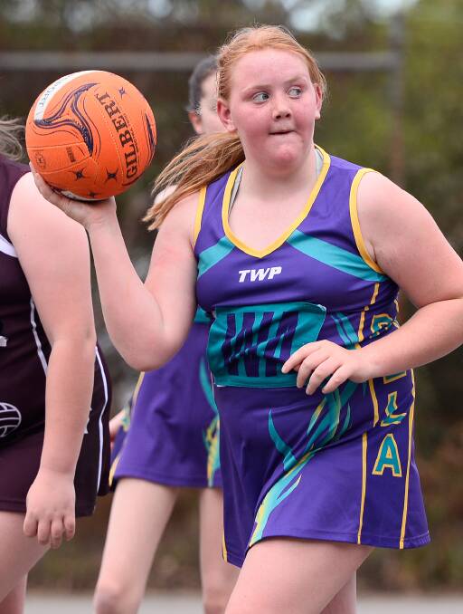 HAVING FUN: Dela player Gracie Lubeek in action during the 13/under division of the Ballarat Netball Association on Monday.
