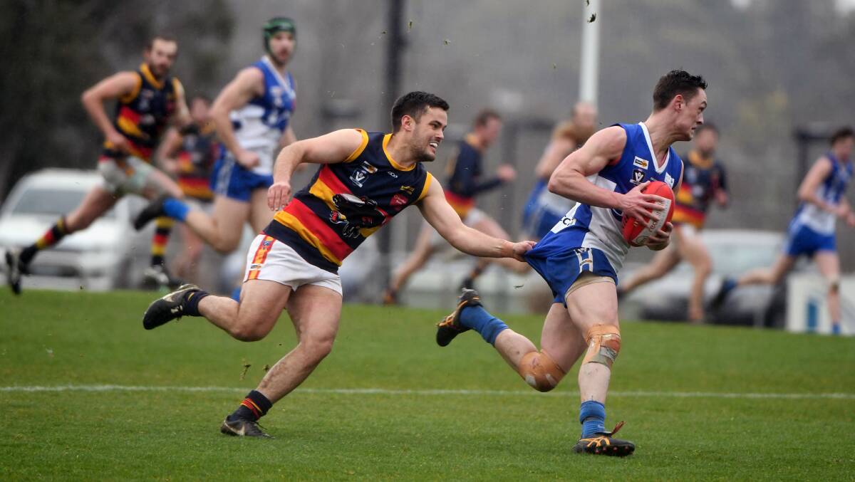 TACKLE: Beaufort's Jayden Orr tries to stop Waubra's Will Corbett during Saturday's preliminary final. The Crows won the match by two points.