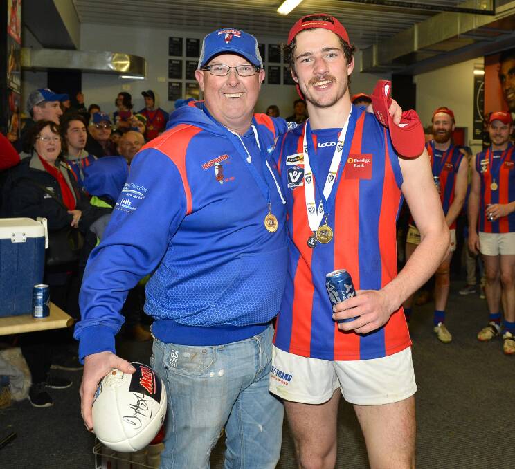 PROUD: Olver with the grand final's best on ground medal winner Jacob Brown. Brown booted four goals in a standout display for the Burras.