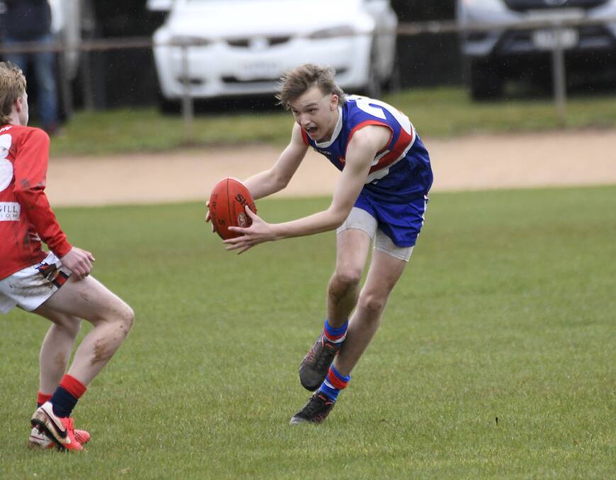 MY BALL: Daylesford under-15 player Riley White picks up possession during the clash with Skipton. Picture: Lachlan Bence.