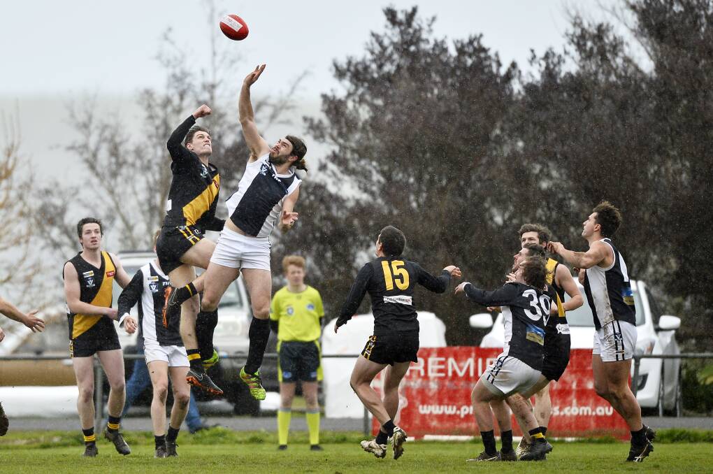 FLYING HIGH: Ruckmen Brock Freeman (Springbank) and Rylan Rattley (Dunnstown) compete during Saturday's clash. Picture: Dylan Burns.