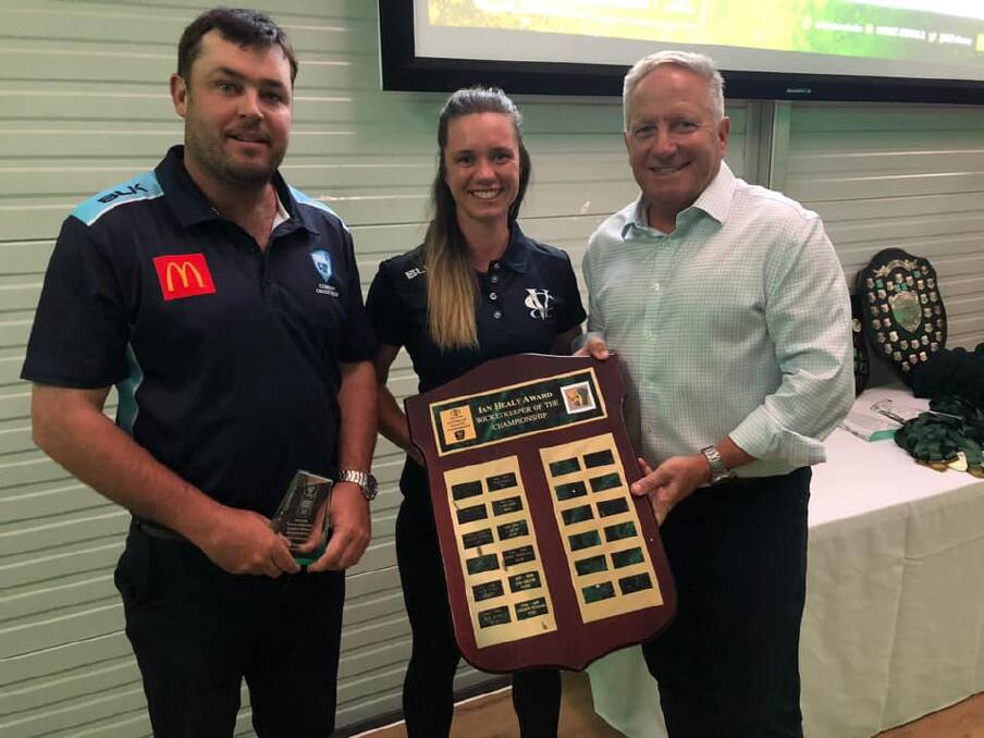 AWARD WINNER: Victorian player Emma Lynch is presented with her award by Australian cricketing great Ian Healy. Picture: VCCL Facebook.