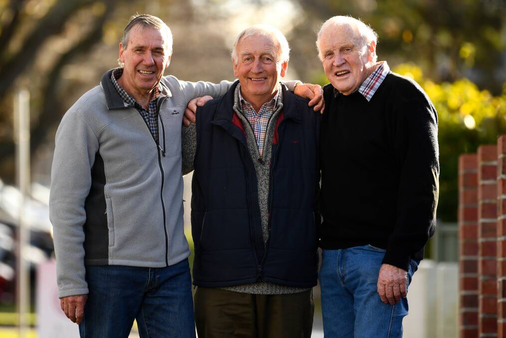 GLORY DAYS: John Perkins, Ada Franc and Tom Jess catch up ahead of Beaufort's 1969 premiership reunion, which will be held next month. Picture: Adam Trafford.