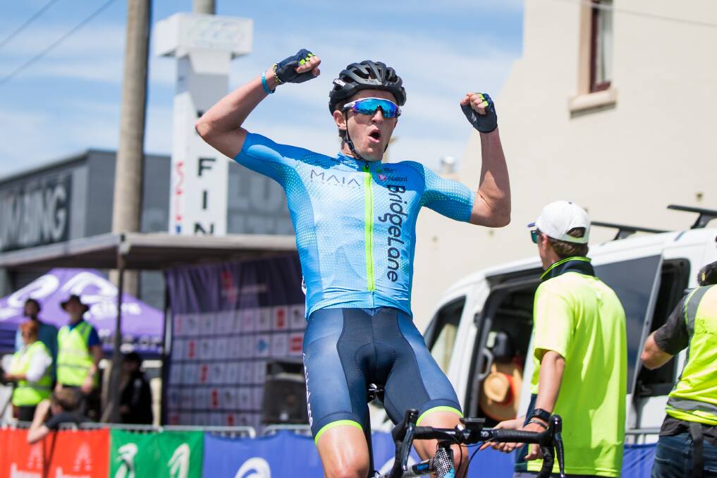 TRIUMPHANT: Ballarat's Nick White celebrates his win in the Melbourne to Warrnambool Cycling Classic on Saturday. He won in a time of six hours, 15 minutes and six seconds. Picture: Christine Ansorge.