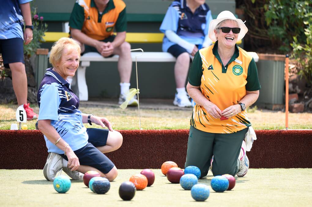 HAVING A LAUGH: Eileen Spong of Clunes (left) and Pam Hayes of Buninyong had plenty of fun in Monday's premier division match.