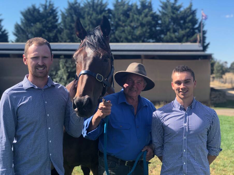 HIGH HOPES: Trainer Terry Kelly (centre) with owners Bill Woodgate and Sam McNish and star galloper Foundry. The horse is being aimed at the Al-Star Mile on March 16.