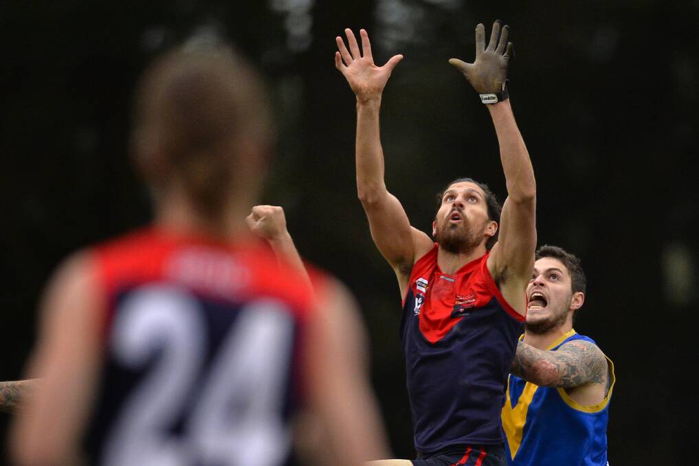 HANDS UP: David Benson in action for the Demons this season.