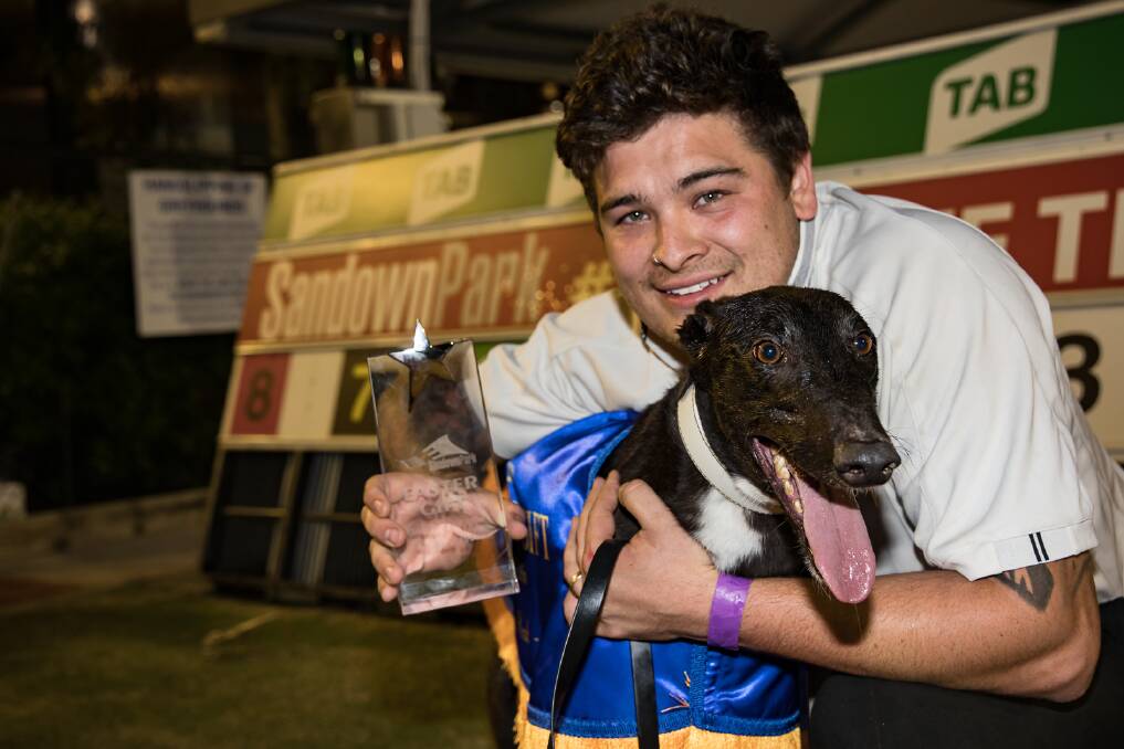 AIMING HIGH: Trainer Correy Grenfell with star greyhound Tiggerlong Tonk which will run in tonight's Melbourne Cup final at Sandown Park. Picture: Jason McKewon.