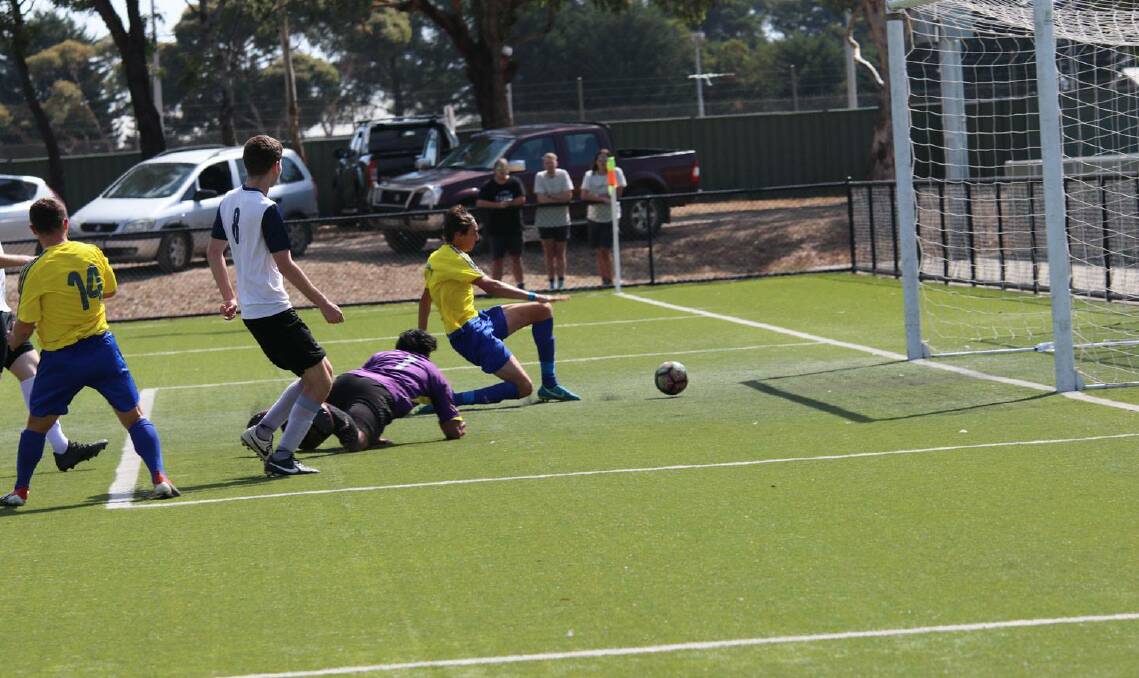 GOAL: Sebastopol Vikings forward Edwin North lunges to score one of his two goals in Saturday's victory over Springvale City at Morshead Park. Picture: Sebastopol Vikings.