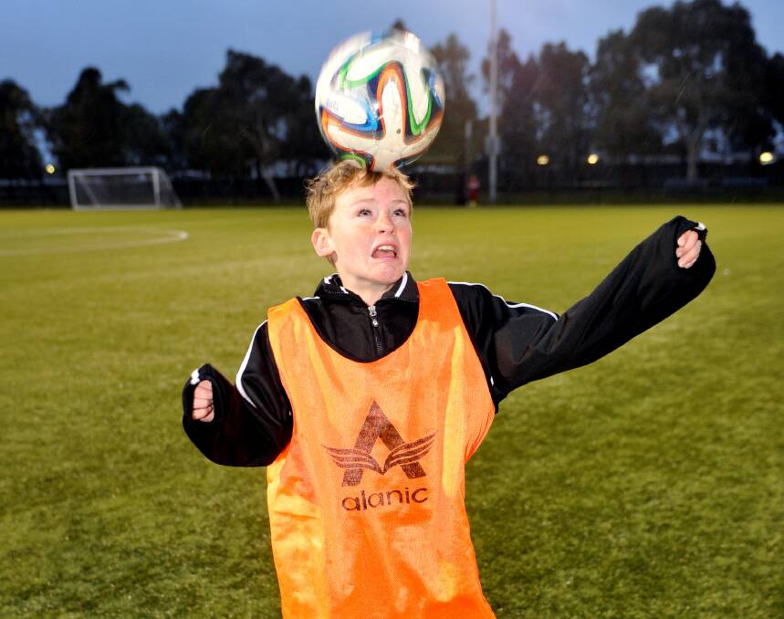 HEADS UP: Youngster Ryan Carton practices his headers - a skill that is being banned for players under 10 in the US.