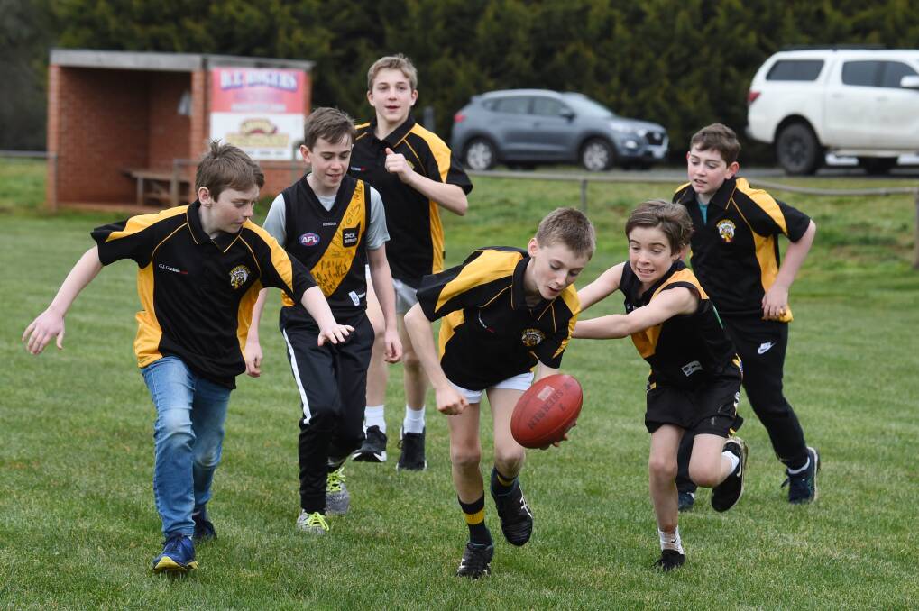 READY TO PLAY: Lachie Simpson, 10, Callum Simpson, 11, Miles Lovison, 12, Lachlan Goss, 12, Max Kinniburgh, 12 and Henry Simpson, 10 practice at Wallace on Saturday. Picture: Kate Healy.