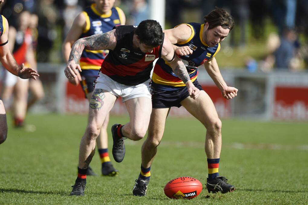 ONE ON ONE: Buninyong's Tim Brayshaw tries to win the ball from Beaufort opponent Rupert Sangster during the clash at Mars Stadium.