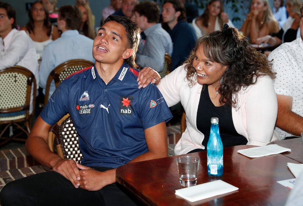 Jamarra Ugle-Hagan celebrates with family after being announced as the number one pick during the AFL Draft. Picture: Getty Images.