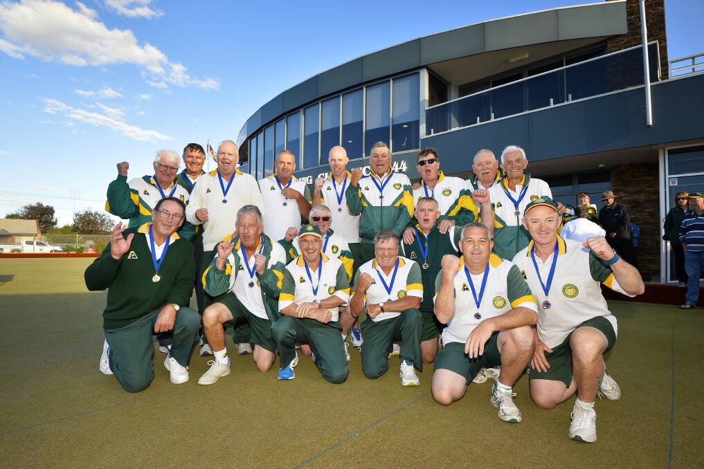 CHAMPIONS: Buninyong players celebrate the 2017-18 division one premiership, which gives the club a spot in the last ever premier league season.
