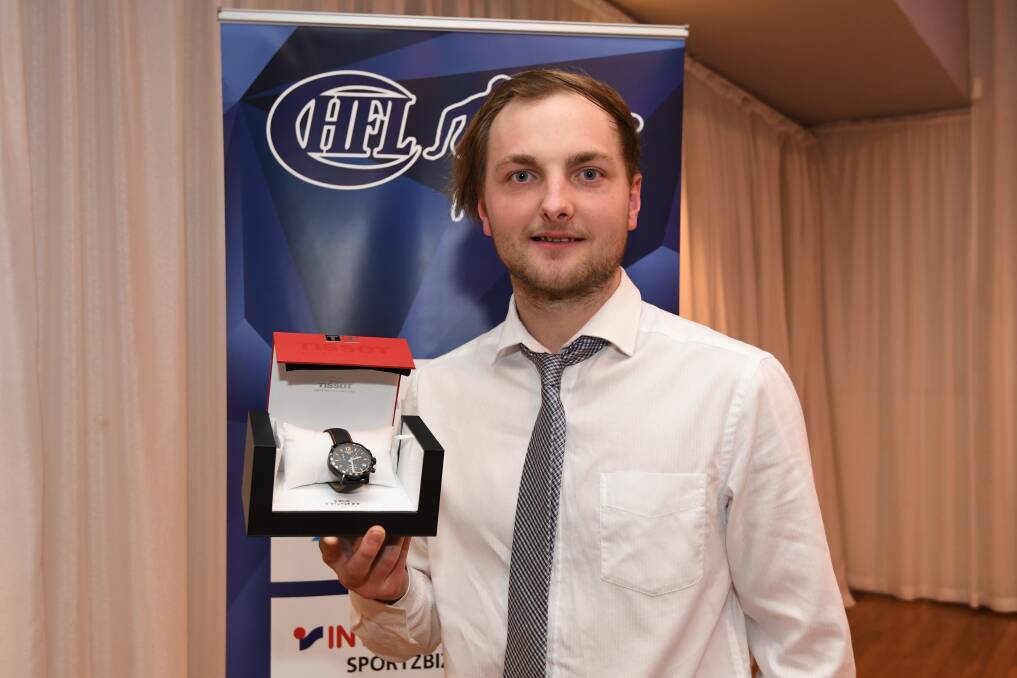 TOP SEASON: Ryan Thompson's brother Aidan with The Courier footballer of the year award for season 2018. Picture: Lachlan Bence.