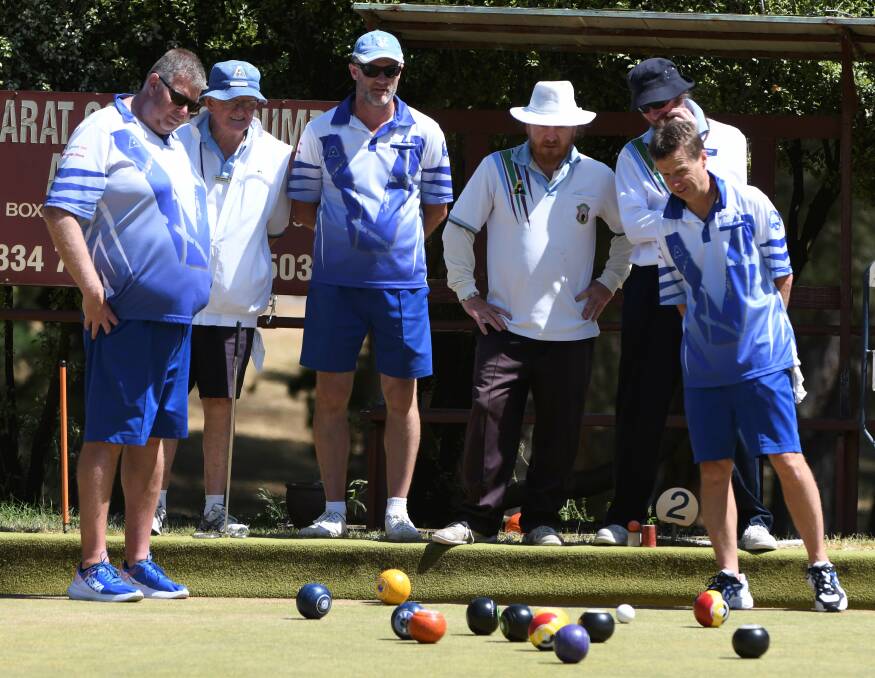 BATTLE: Victoria and Mt Xavier bowlers watch play unfold on Saturday. Pictures: Lachlan Bence.