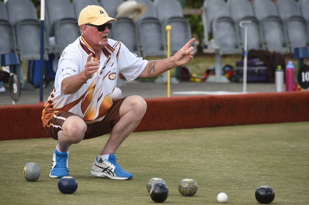HELPING OUT: City Oval bowler Mitch Walton gives some guidance to a teammate on Saturday. Picture: Kate Healy.