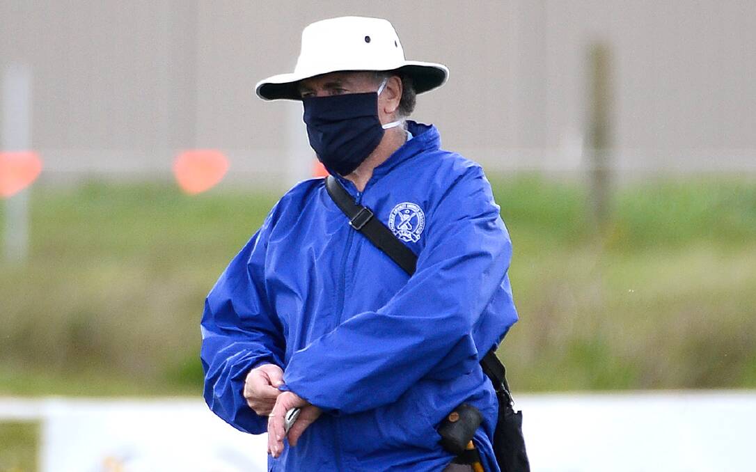 MASKED UP: Ballarat Cricket Umpires Association member Geoff Georges is pictured officiating during a practice game at Ballan on Saturday. Picture: Adam Trafford.