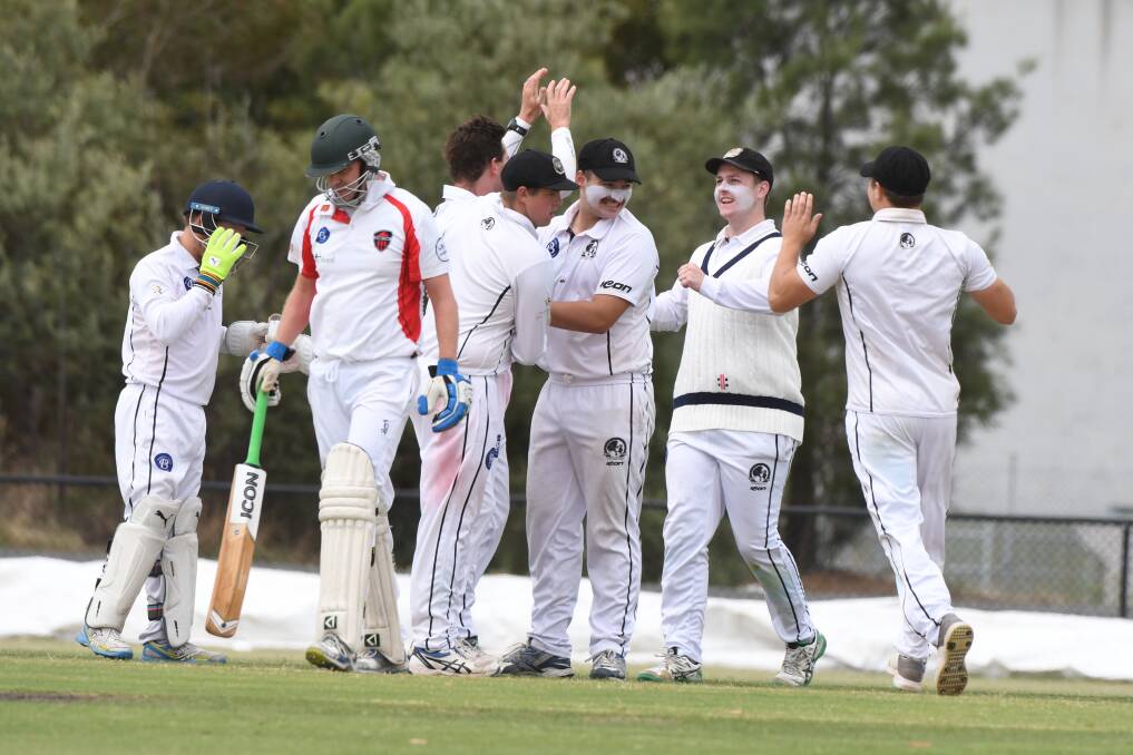 North Ballarat players celebrate a wicket on Saturday. Picture: Kate Healy.