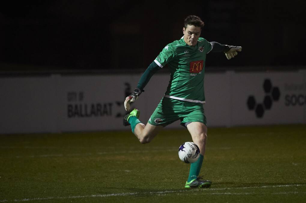 CLEARANCE: Ballarat City goal-keeper Joshua Dorron sends his side into attack in the game against Moreland City on Saturday night. The clash ended with the visitors winning 2-1.