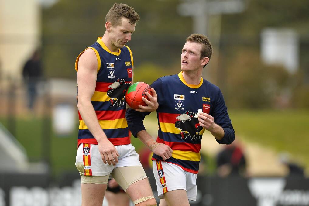 ADVICE: Beaufort reserves coach Adrian Beer talks to teammate Thomas McGregor before a set shot at goal last year.