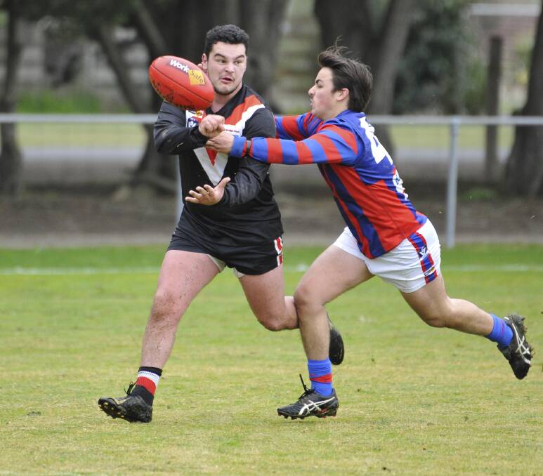 DEFENDER: Nathan Achison (left) in action on Saturday. Picture: Lachlan Bence.