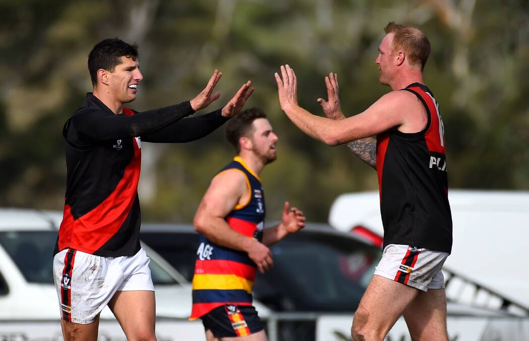 Buninyong's Derick Micallef celebrates a goal with Mark Phelps. Picture: Adam Trafford.