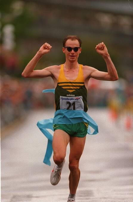 Steve Moneghetti raises his arms as he crosses the finish line for Commonwealth Games gold medal in the marathon in 1994. Picture: CRAIG GOLDING