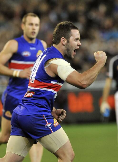 FIRING: Ballarat football export Andrew Hooper celebrates a goal in his AFL debut, a semi-final win for Western Bulldogs in 2010. He was dropped a week later, making way for Dale Morris' return. Picture: The Age