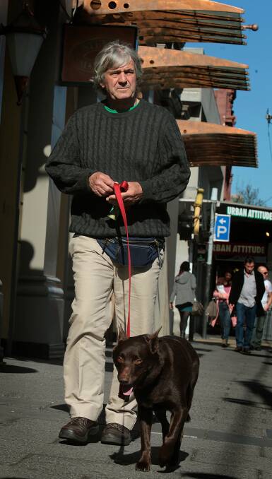 LEFT: Luke Hura walks Koko, the star of the film Red Dog, through the city streets of Melbourne in 2011 - a long way from the outback where much of the movie was shot. 