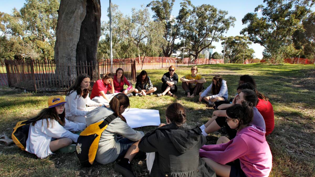 TEACHING: Belinda Duarte, who is of Wotjobaluk descent, talks to emerging female Aboriginal leaders at a scar tree near the MCG in 2012. Picture: The Age
