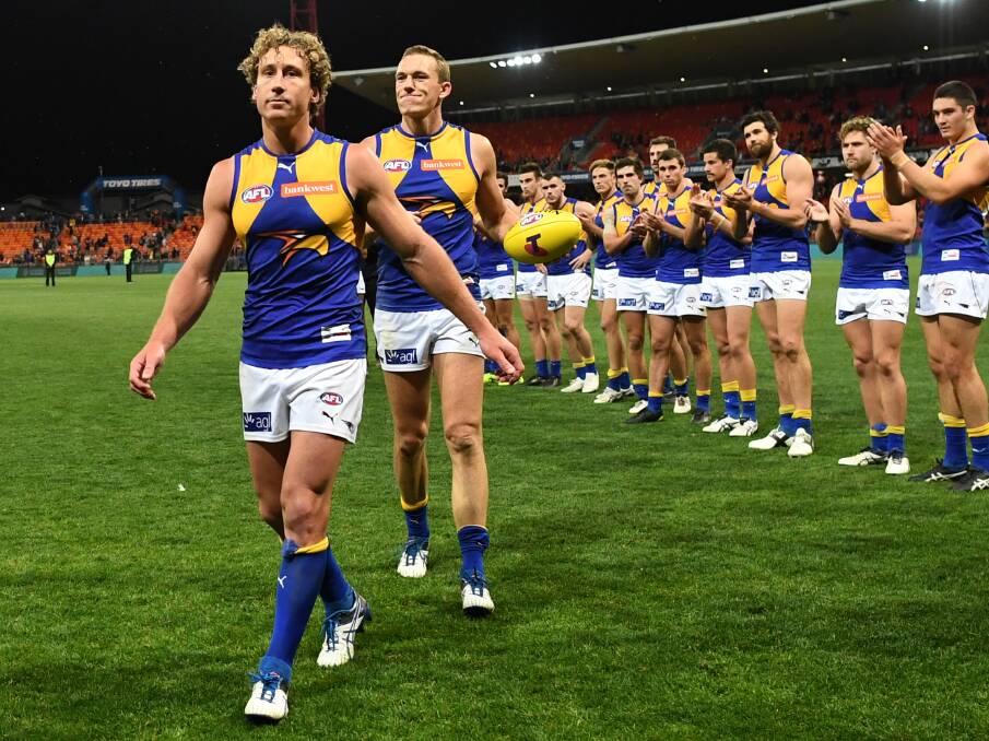 FAREWELL: Ballarat export Drew Petrie (right) leaves the ground in his final AFL match, a semi-final loss to Greater Western Sydney in Sydney on Saturday night. Picture: AAP