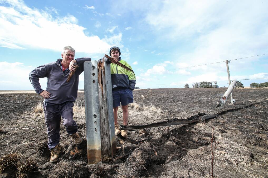 Bernie Harris and Jack Kenna Junior at the site of the The Sisters fire, next to the broken fire pole. Picture: Christine Ansorge