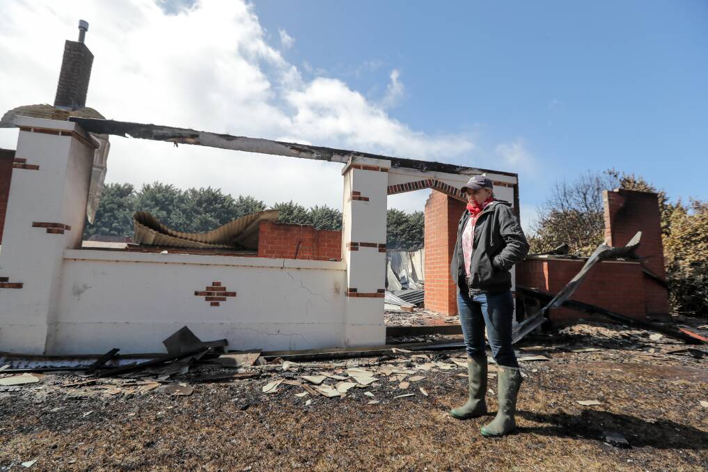 SAD TIMES: Gazette resident Elle Moyle in front of her brother's burnt out house on her family's property. Guests at a wedding on the farm had to be evacuated as the fire threatened the homestead. Picture: Rob Gunstone