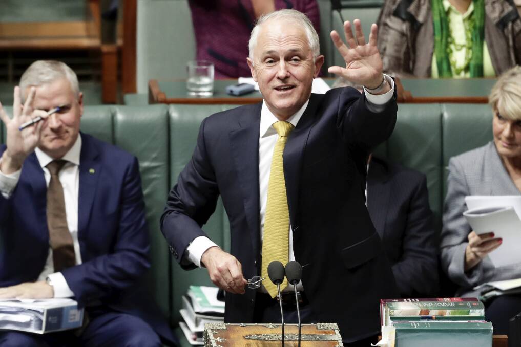 Prime Minister Malcolm Turnbull waves and calls out to Leadership Ballarat Western Region delegates during Question Time at Parliament House in Canberra on Wednesday. Picture: Alex Ellinghausen