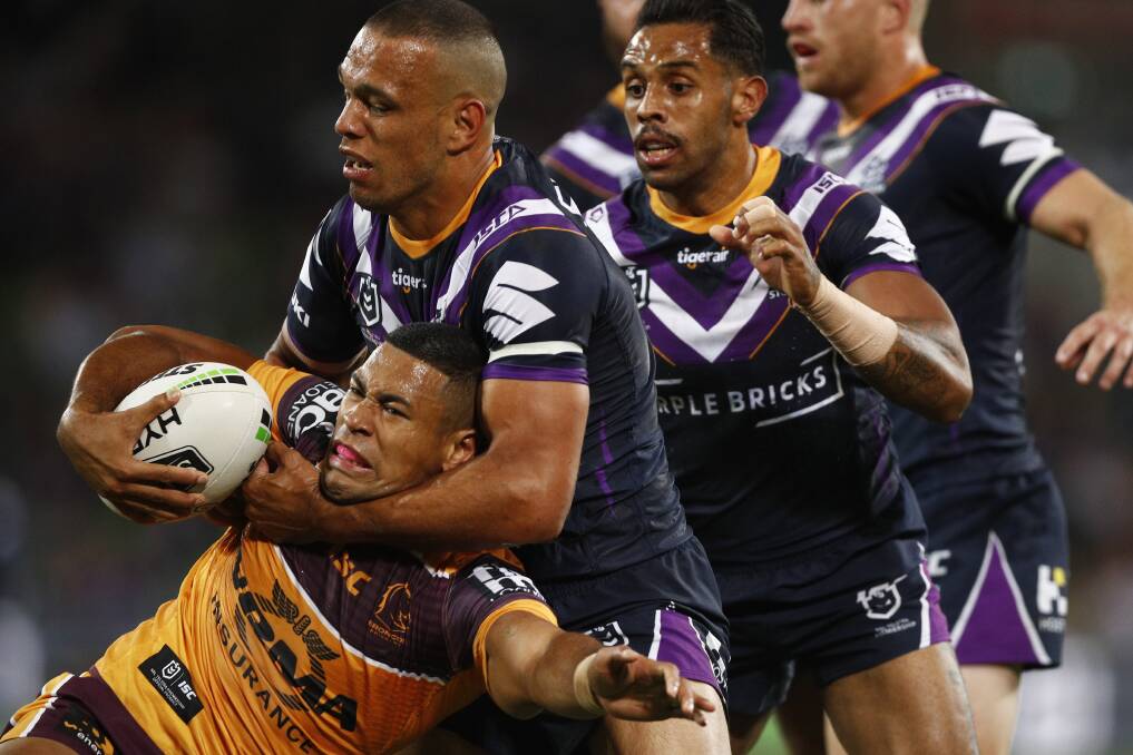 Melbourne Storm players wear white armbands in their NRL season opener against Brisbane Broncos at AAMI Park in Melbourne. Picture: AAP